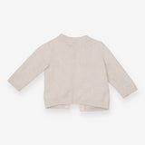 Beige knit animal cardigan with blue pom poms