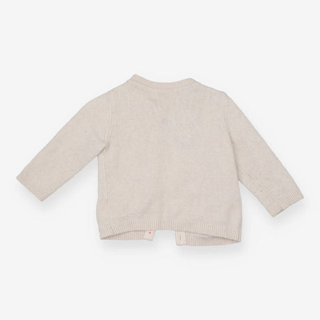 Beige knit animal cardigan with blue pom poms