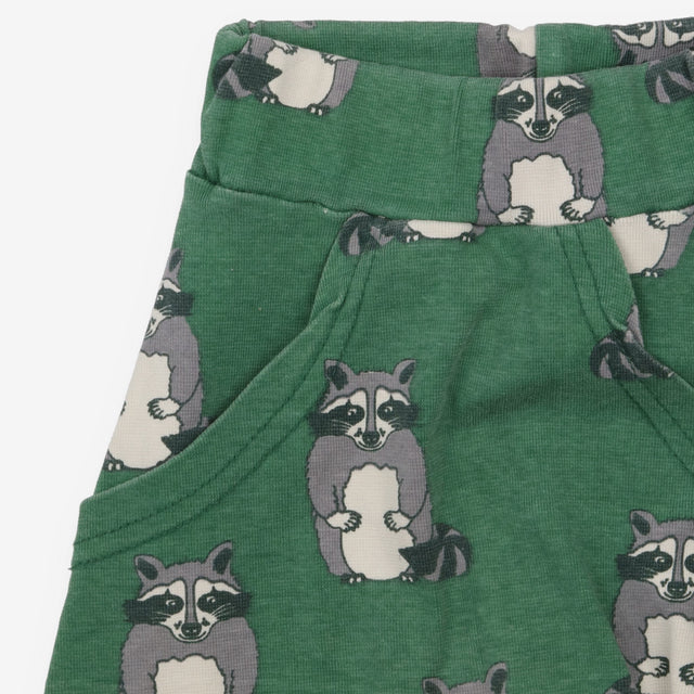 Green joggers with raccoons