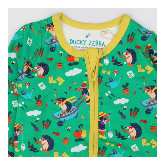 Sleepsuit with gardening dog and hedgehog