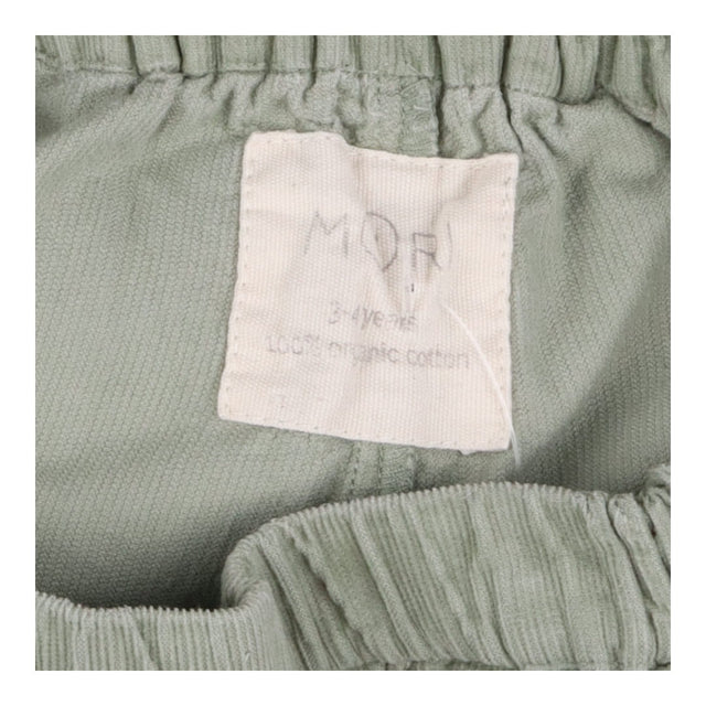 Green cord trousers
