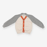 Cardigan grey sleeves cream body orange edging