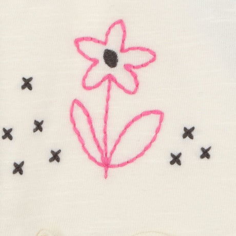 Cream jersey shorts with embroidered flower