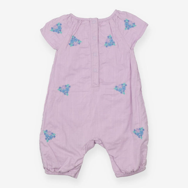 Purple romper with embroidered flowers