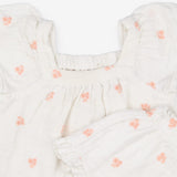 White Top and shorts outfit with peach flowers