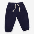 Navy joggers with white drawstring