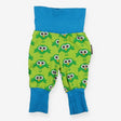Green joggers with owls and blue cuffs