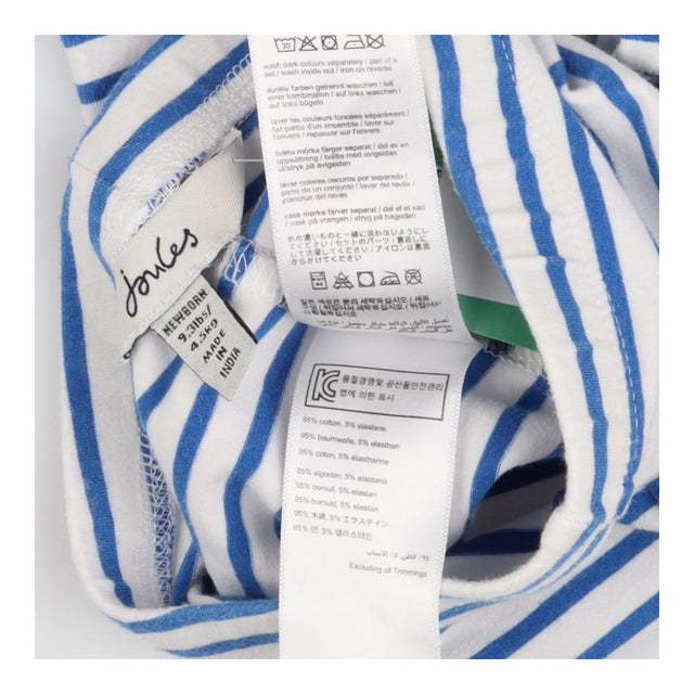 White and blue stripe leggings weith yellow logo