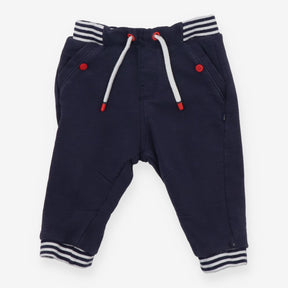 Navy joggers with red buttons