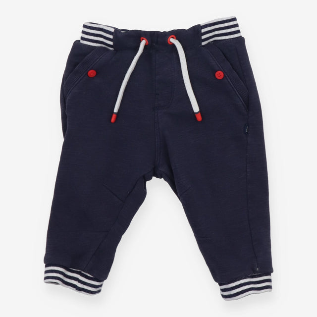 Navy joggers with red buttons
