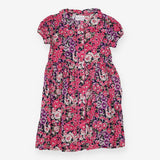 Navy dress with bold pink and purple flowers