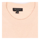 Pink knit crew neck sweater with side button deta