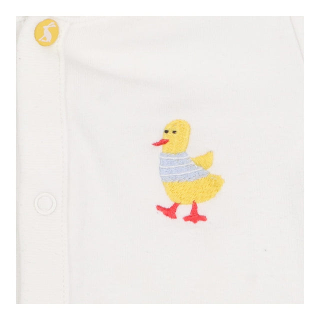 White sleepsuit with yellow duck 