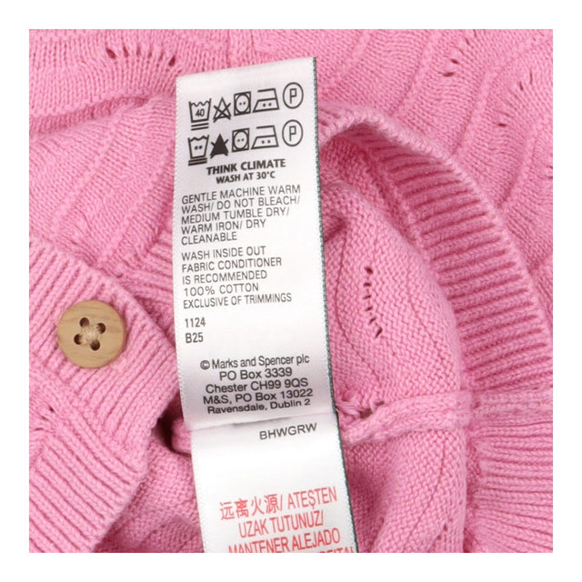 Pink knit cardigans with wooden button
