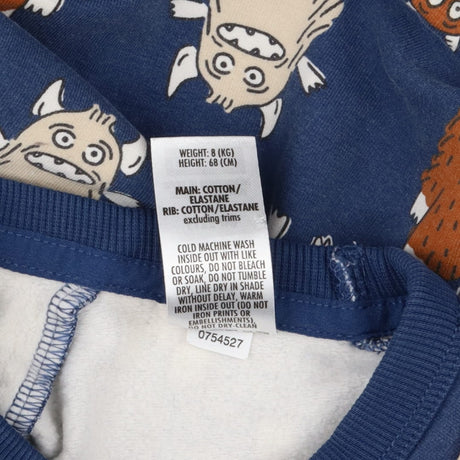 Blue tracksuit with furry monsters