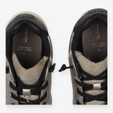 Grey trainers, black laces