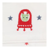 White sleeping bag with red stars and alien