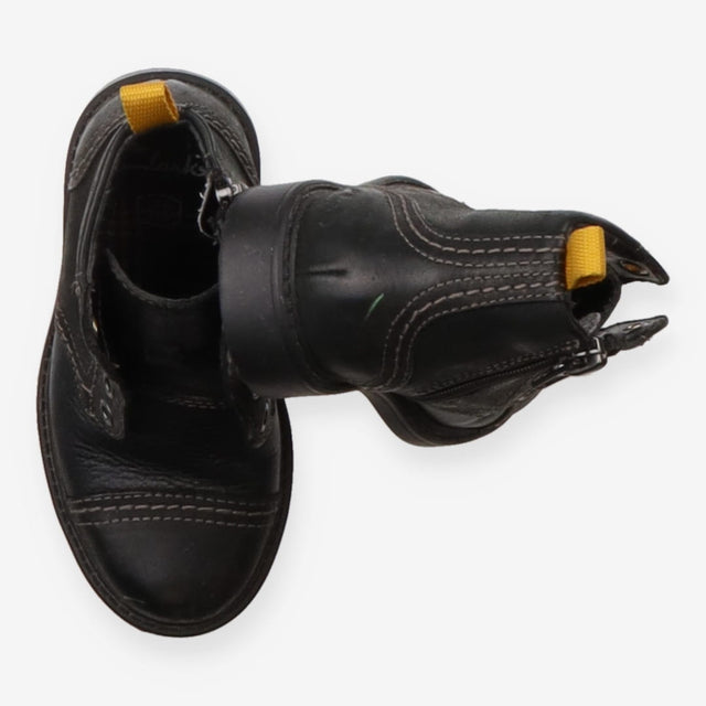 Black boots yellow eyelets