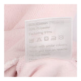 Pink velour sleepsuit with bunny faces